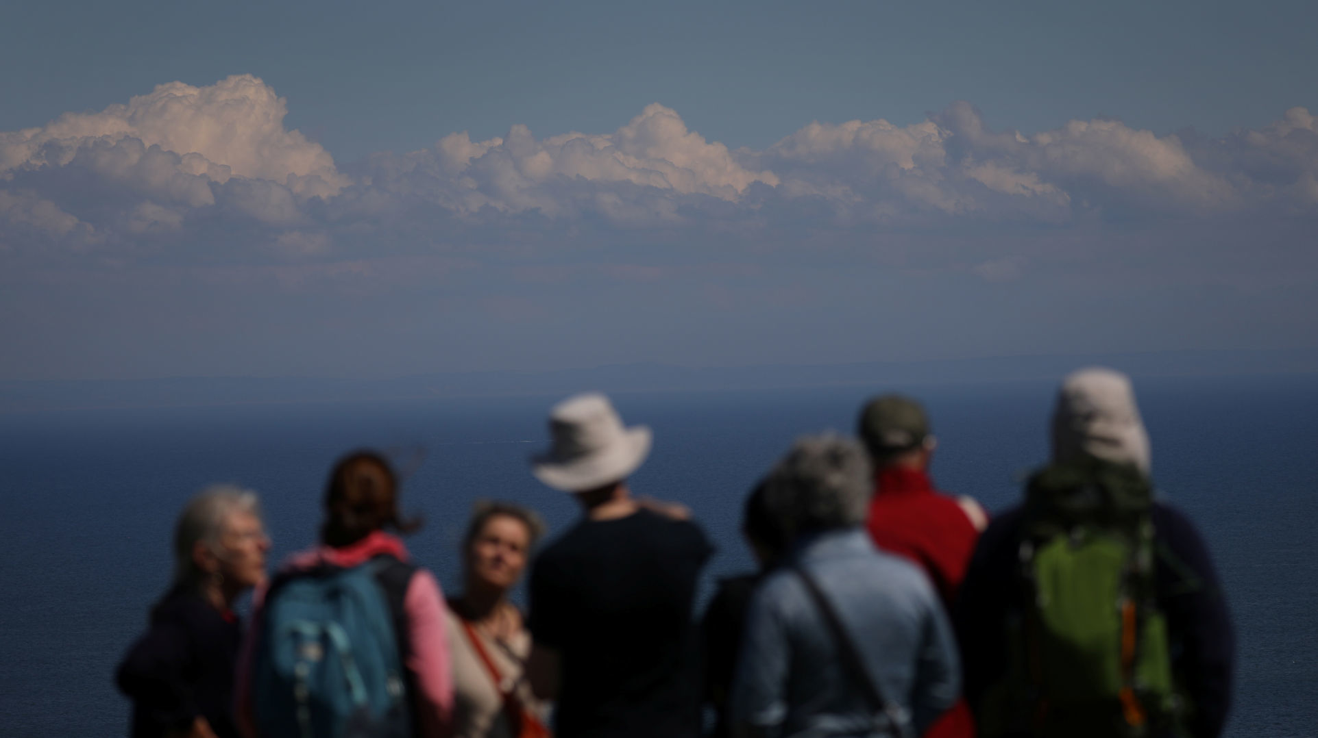 Members of the Cloud Appreciation Society are seen below Cumulus and Stratocumulus clouds during their gathering on Lundy